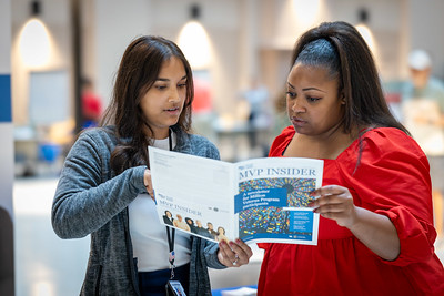 two women with brochure