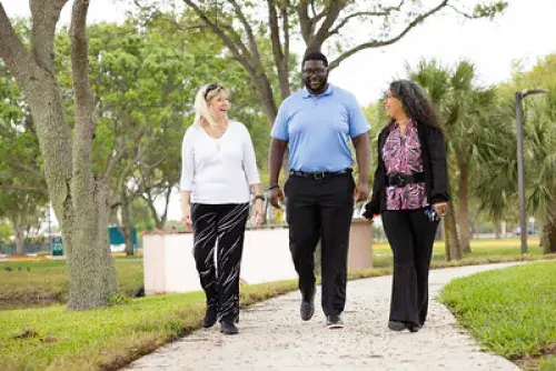 three veterans walking on a path